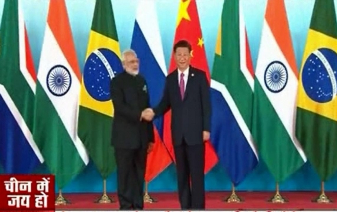 PM Modi welcomed by Jinping in BRICS 2017