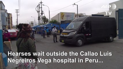 Hearses line up to collect bodies outside Peruvian hospital