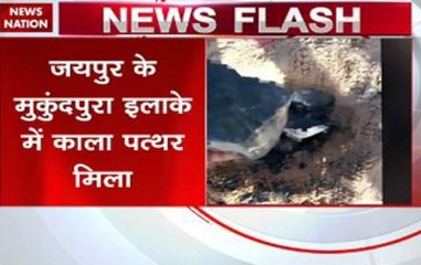 Black coloured rock-like object falls from sky, appears to be meteorite