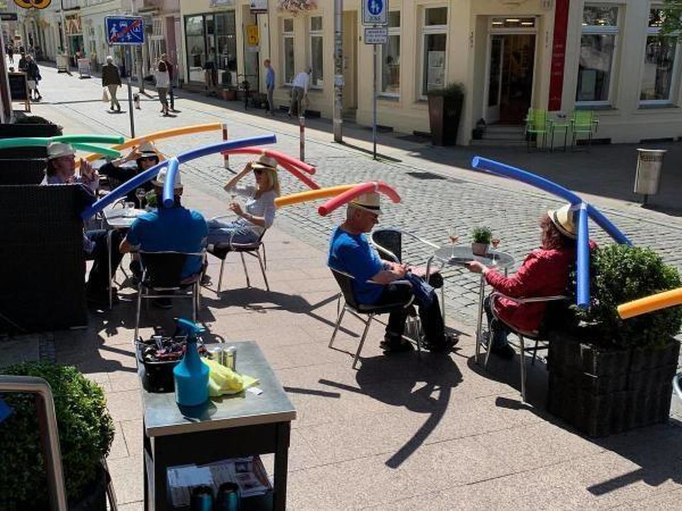 A German Cafe Made Pool Noodle Hats to Enforce Social Distancing