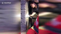 Chinese firefighters free boy trapped in between walls