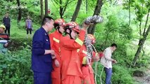 Drone used to rescue Chinese digger drivers trapped in flooded river after rainstorm
