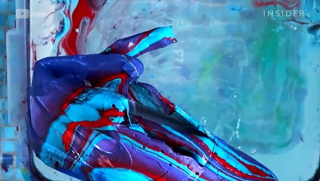 Watch this artist hydro dip sneakers into colorful paints