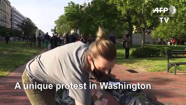 Protesters stage mock funeral procession with 'body bags' outside White House