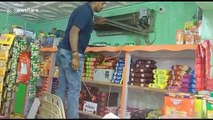 Man struggles to catch deadly cobra hiding in air conditioner of bakery in eastern India