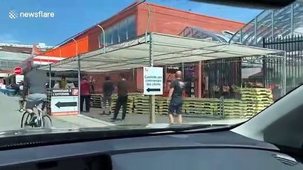 Canadians lineup outside a Home Depot in Montreal