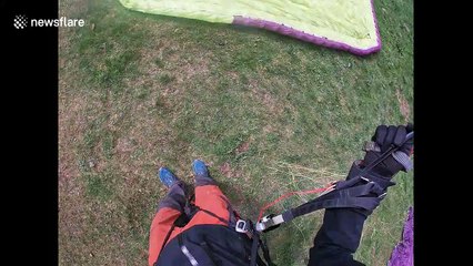 Watch this near-fatal paragliding fail where chute ALMOST didn't open