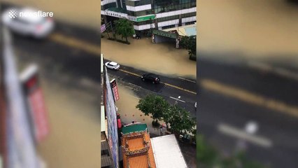 Heavy rain causes flash floods in Taiwan closing schools and offices