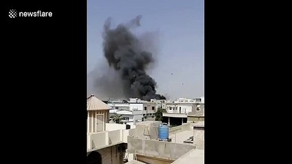 Smoke billows from Karachi passenger jet crash site