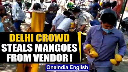 Delhi crowd loots mangoes worth thousands from a street vendor: Watch | Oneindia News