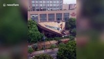 Hotel canopy collapses in China burying vehicles underneath debris
