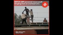 WATCH: Railway Police rescue youth dangling from an overhead wire in MP