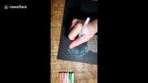 Artist draws rainbow circles with one continuous line