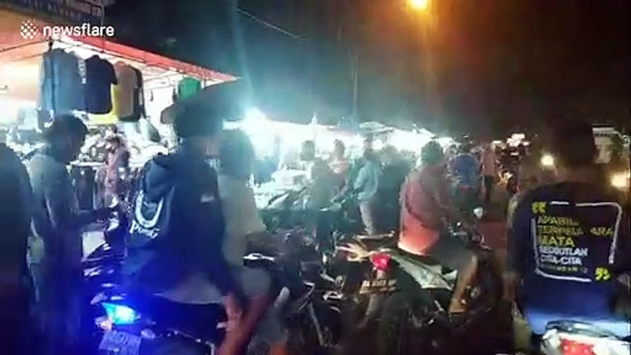 Tens of thousands crowd streets of Indonesian city ahead of Eid despite lockdown