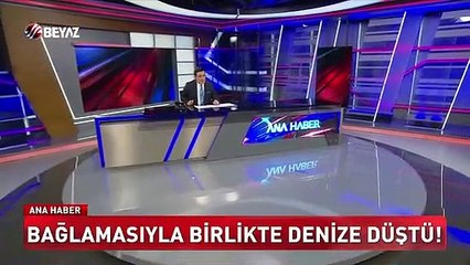 Bağlamasıyla birlikte denize düştü!