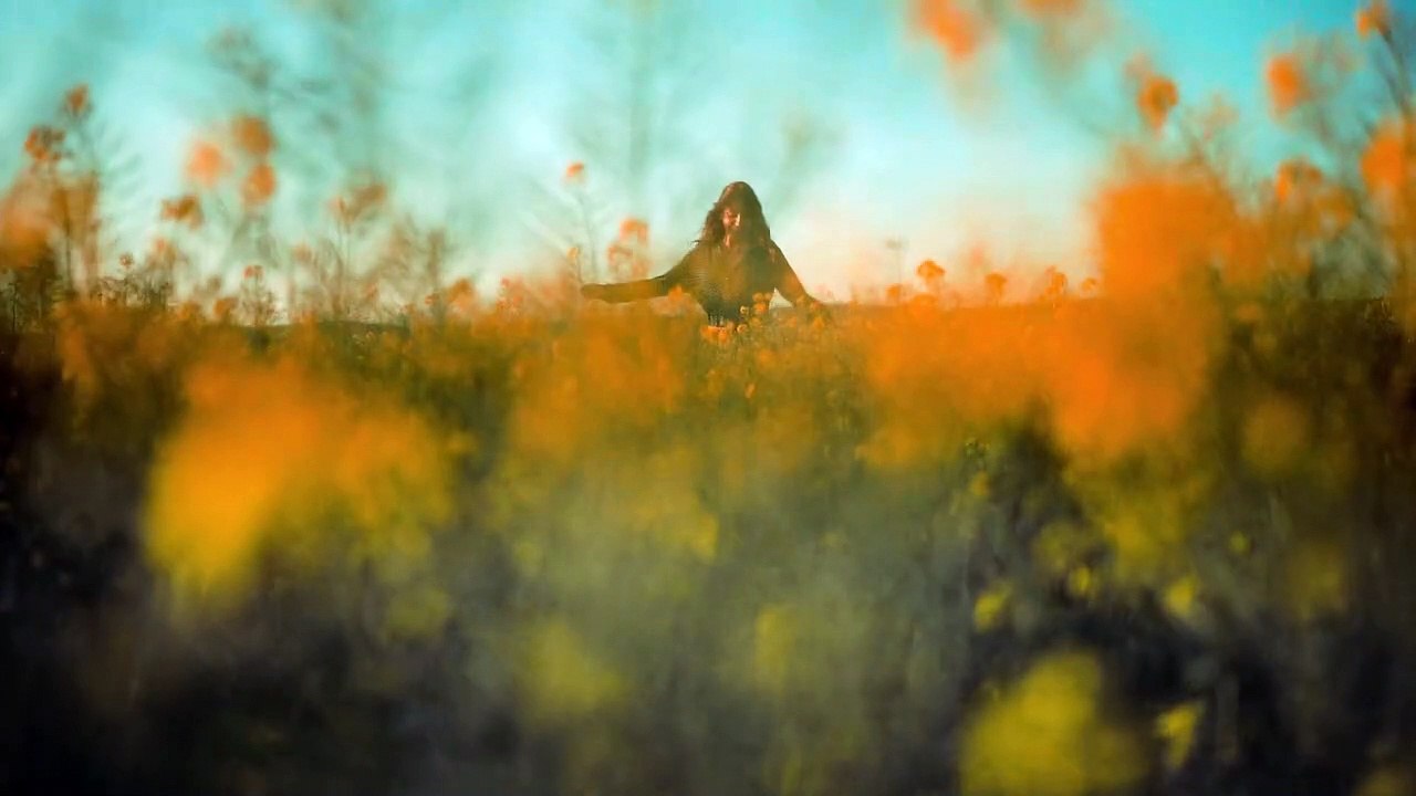 Woman Dancing Happily In The Middle Of The Field Of Flowers