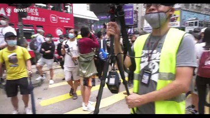 Tension in Hong Kong as projectile-hurling protesters force riot police to retreat