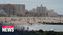 Americans head to beach over holiday weekend while COVID-19 death toll expected to reach 100,000