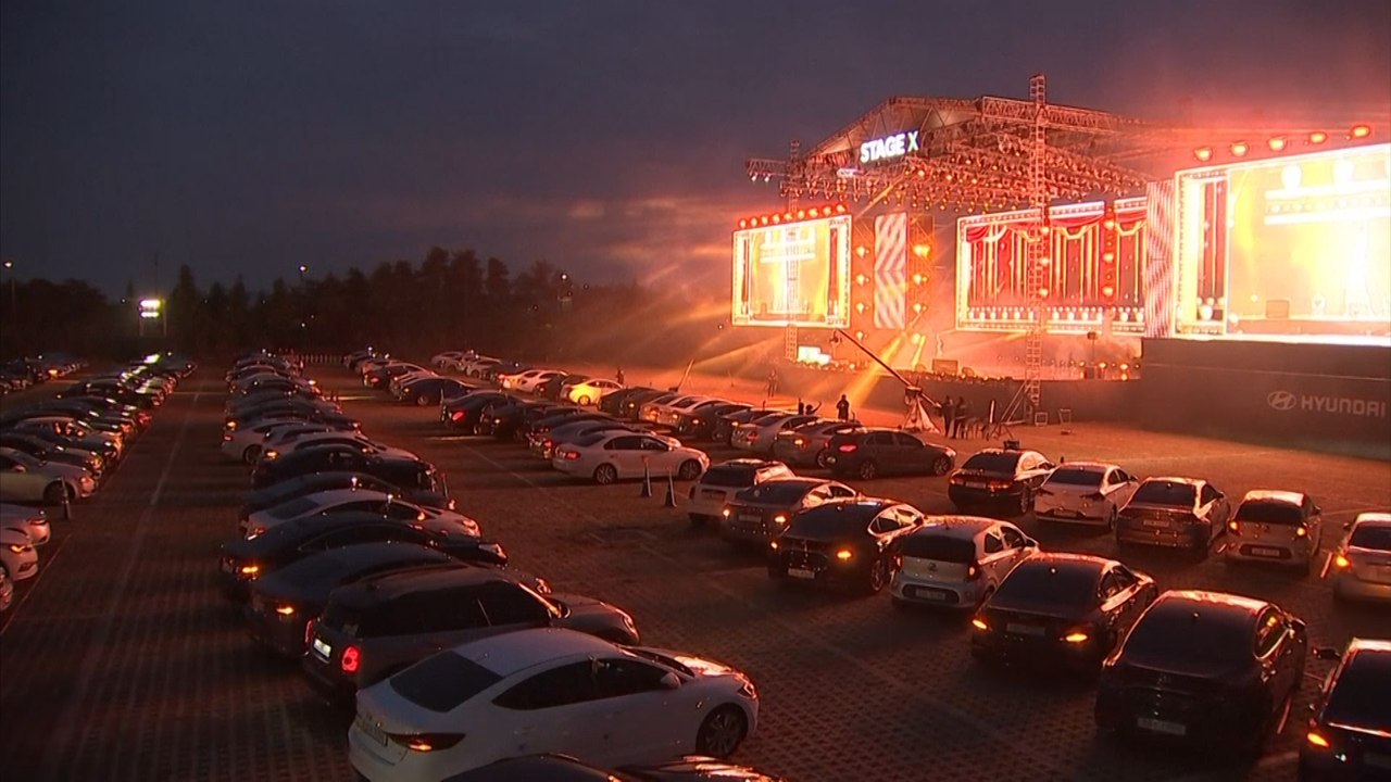 South Koreans social distance at drive-in K-pop...