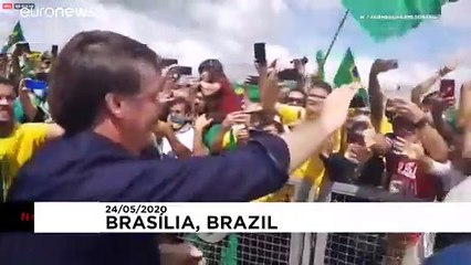 Supporters greet Bolsonaro amid controversy over cabinet video