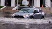 Cars plow through severe flooding in Miami