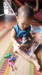 Newborn baby playing supper man game (supper man game)