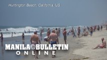 Beachgoers enjoy sand and sun in California on Memorial Day