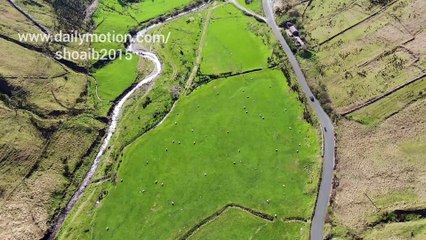 Aerial View Of Vehicles Travelling Across The Valley