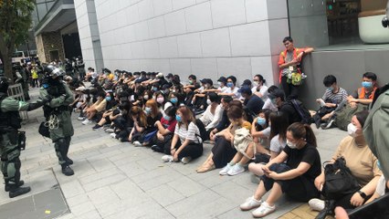 Police stop and search people in Causeway Bay as protesters oppose national anthem bill
