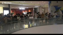 Protesters gather in Hong Kong shopping mall to chant slogans against national anthem bill