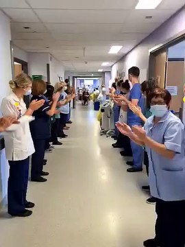 Nurse Becky Usher is applauded as she leaves Pinderfields Hospital