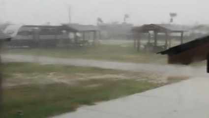 Bertha blows ashore with heavy wind and rain