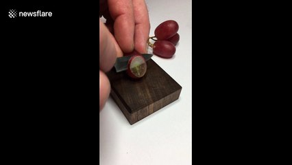 Incredibly tiny knife slices grape with super-satisfying ease