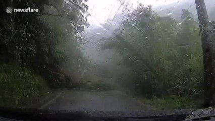 Landslide blocks mountain road during storm in Taiwan
