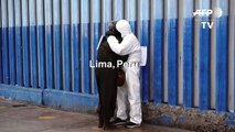 Worried relatives wait outside hospital in Lima