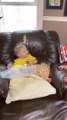 Toddler Sitting in Recliner Chair Pours Cereal All Over Himself