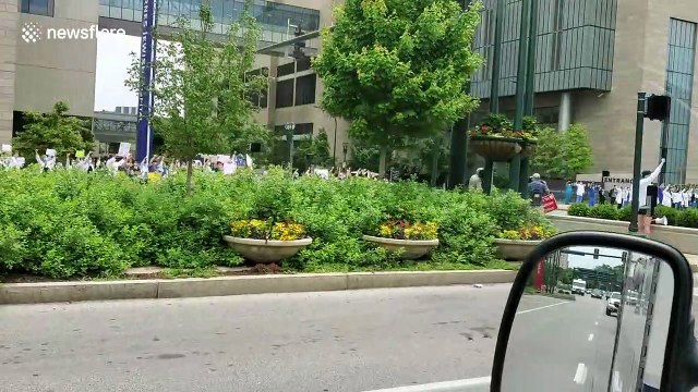 'White Coats for Black Lives': St. Louis hospital staff line the sidewalks in their hundreds to show solidarity with Black Lives Matter