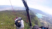 Terrifying moment two paragliders collide at nearly 5,000ft and plummet into trees
