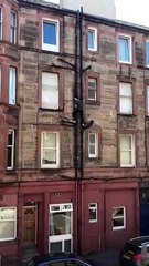 Man scales building to get into flat after being locked out.