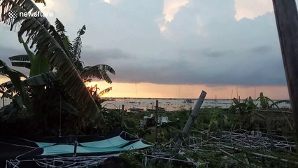 Rare triple waterspout forms in front of sunset in the Philippines