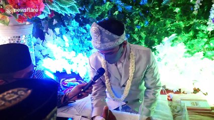 You may NOT kiss the bride! Couple weds in masks during pandemic