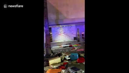 US Unrest: Shoe boxes strewn on ground after sneaker store is looted in LA