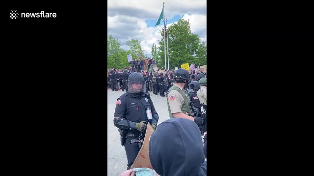 Police officers in Washington State kneel in solidarity with protestors