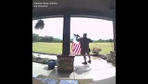 UPS driver stops on delivery route to fix the American Flag