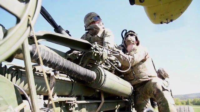 US Army - Heavy-Lift Helicopter - CH-47 Chinook Carrying Heavy Artillery Howitzer