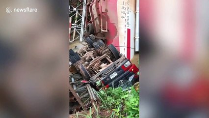 Chinese petrol tanker falls 40ft into river when bridge collapses in Laos