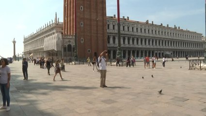 People head to square as travel restrictions ease