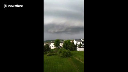 US man amazed by 'arcus cloud' rolling in across rural New York State