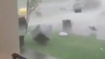 Wind sends furniture flying down street