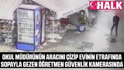 Okul müdürünün aracını çizip evinin etrafında sopayla gezen öğretmen güvenlik kamerasında